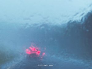 brake lights in drenching rain