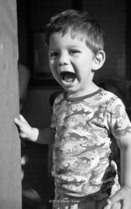 little boy with a happy scream