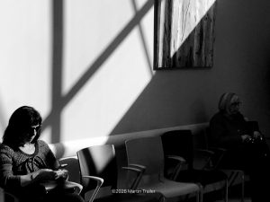 two women in a waiting room with big shadows