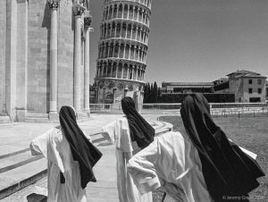 three nuns looking at the Leaning Tower of Pisa