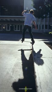 skaterboarder running a bench